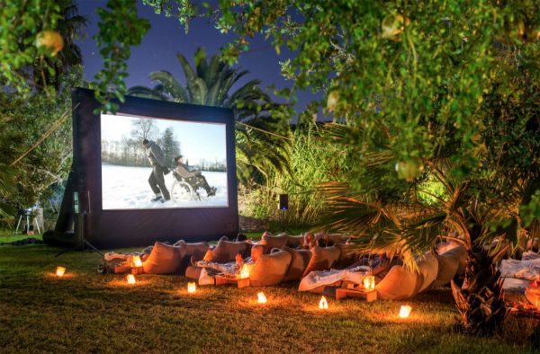 Outdoor movie screen with projector for home hire